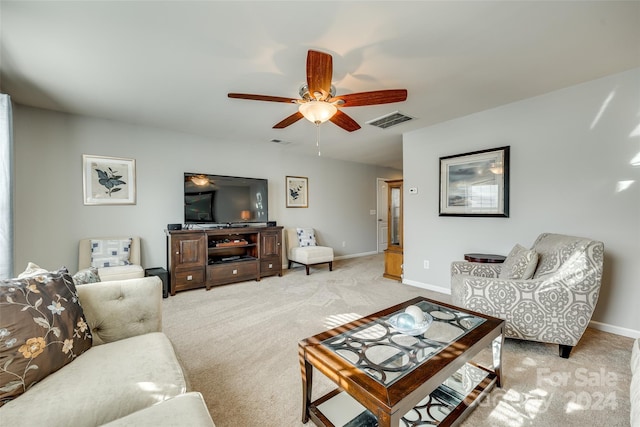 carpeted living room featuring ceiling fan