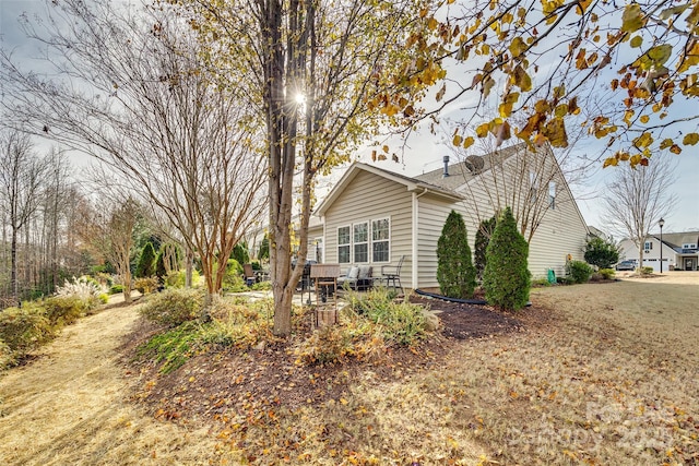 view of side of home with a patio