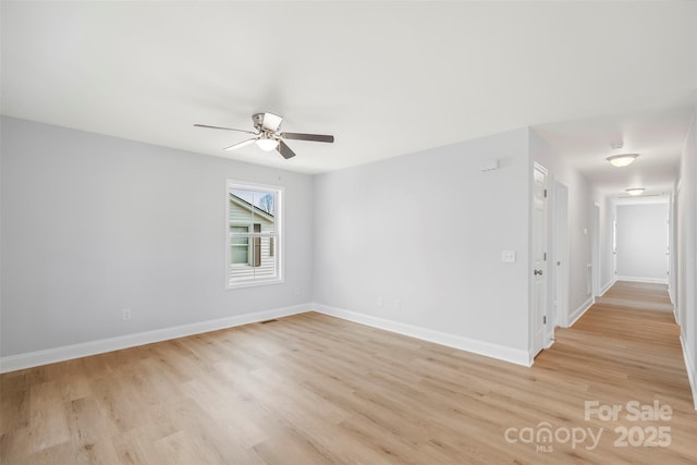 unfurnished room featuring ceiling fan and light hardwood / wood-style floors