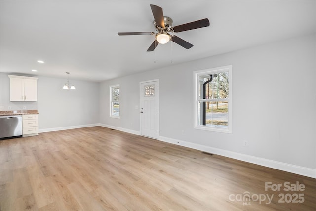 unfurnished living room featuring light hardwood / wood-style flooring and ceiling fan