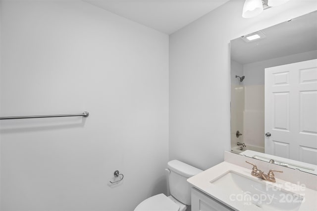 full bathroom featuring vanity,  shower combination, and toilet