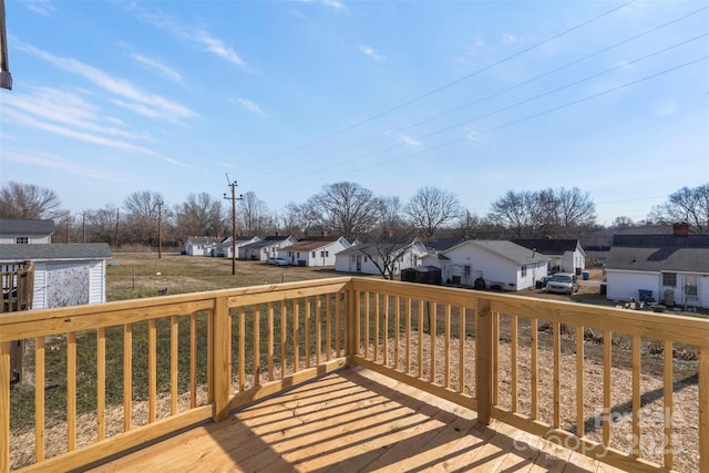 wooden deck with a storage shed