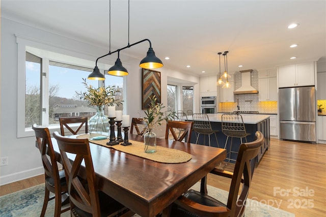 dining area featuring a wealth of natural light and light wood-type flooring