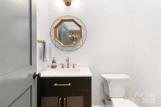 bathroom with vanity and toilet