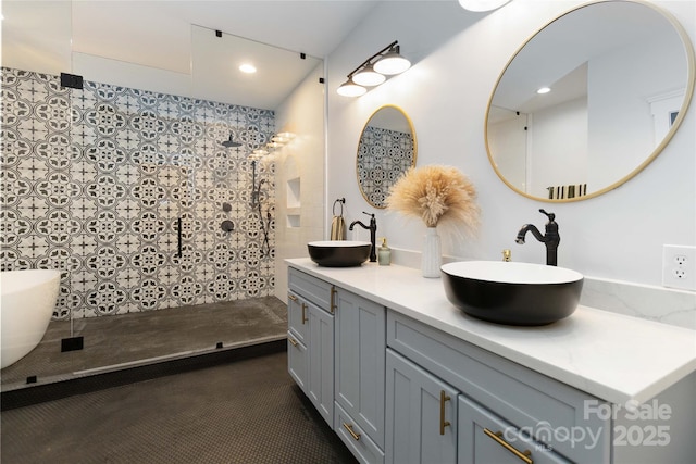 bathroom featuring vanity and a tile shower