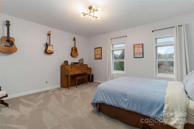 bedroom featuring light colored carpet