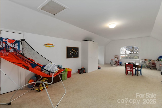 recreation room featuring lofted ceiling and carpet flooring