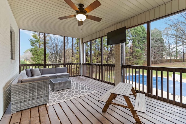 sunroom / solarium with plenty of natural light and ceiling fan