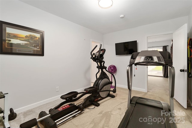 workout room with light colored carpet