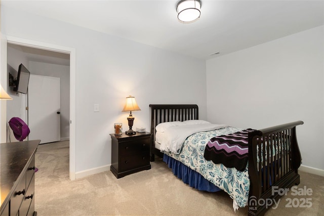 bedroom featuring light colored carpet