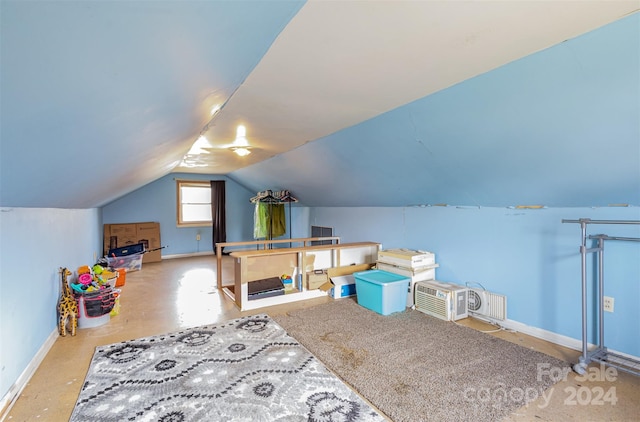 playroom featuring lofted ceiling