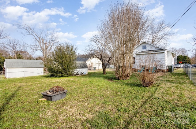 view of yard with an outdoor fire pit