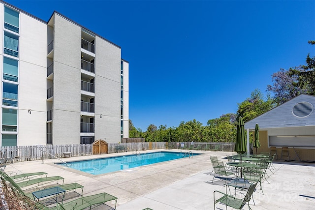 view of swimming pool featuring a patio