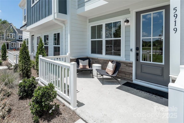 exterior space with outdoor lounge area and board and batten siding