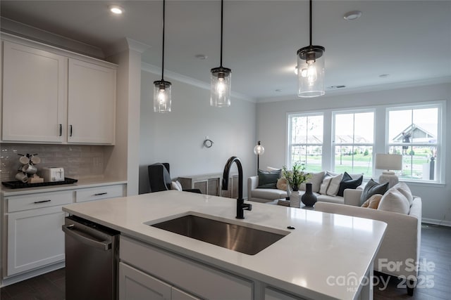 kitchen with a sink, decorative backsplash, dishwasher, crown molding, and open floor plan