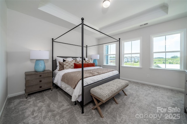 carpeted bedroom with visible vents, multiple windows, and baseboards