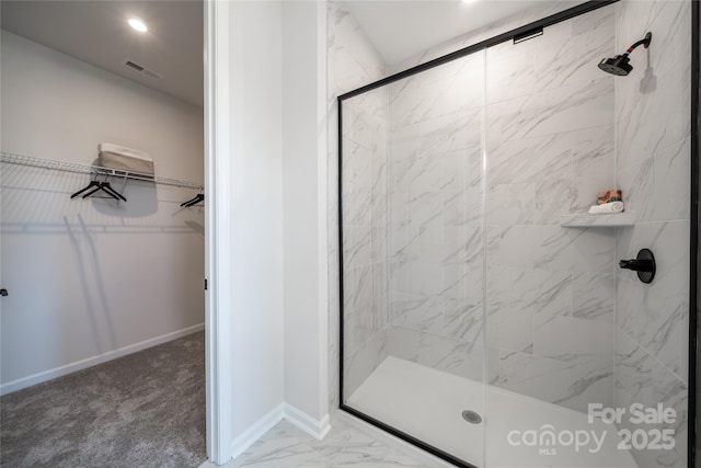 full bath with baseboards, visible vents, a marble finish shower, a spacious closet, and marble finish floor