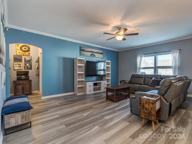 living room featuring ceiling fan, ornamental molding, and hardwood / wood-style flooring