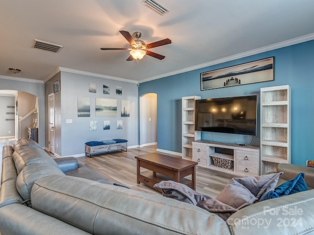 living room with ceiling fan, light hardwood / wood-style floors, and crown molding