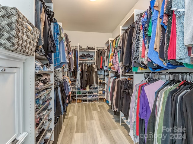 spacious closet featuring hardwood / wood-style floors