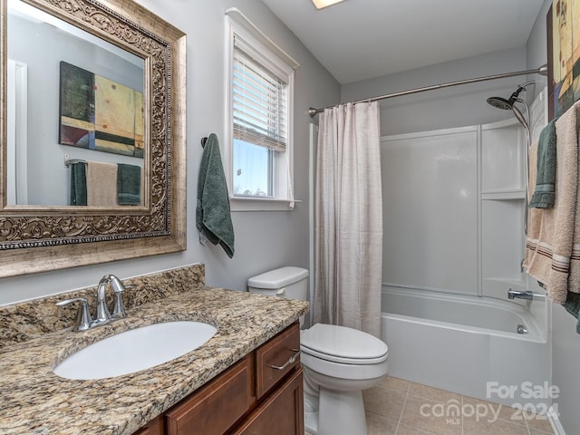 full bathroom featuring shower / bath combo with shower curtain, tile patterned flooring, vanity, and toilet