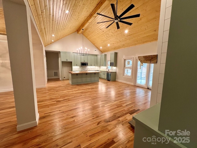 unfurnished living room featuring wood ceiling, high vaulted ceiling, light hardwood / wood-style floors, beam ceiling, and ceiling fan with notable chandelier