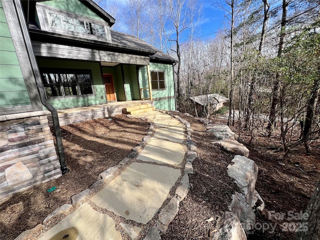 doorway to property featuring a porch