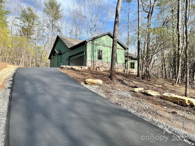 view of side of home with a garage