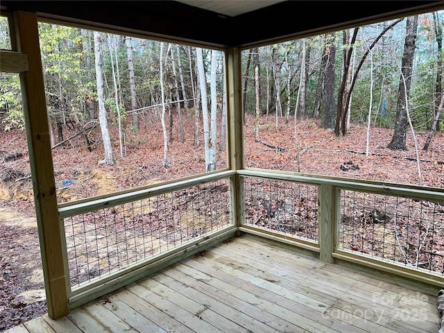 wooden deck featuring a wooded view