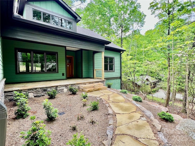 view of front facade featuring covered porch and board and batten siding