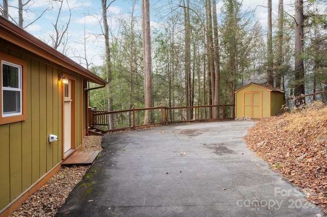 view of patio / terrace featuring a storage shed