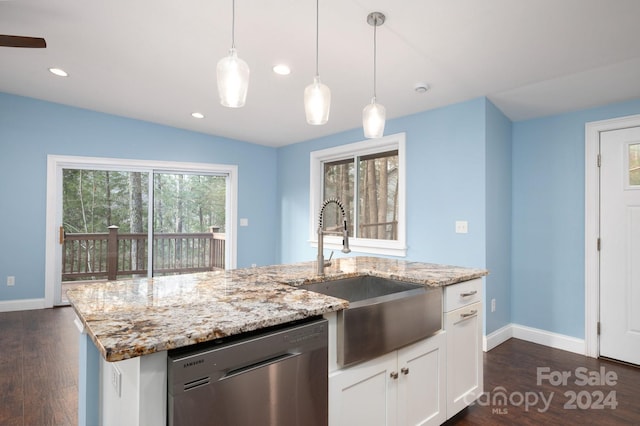 kitchen with a healthy amount of sunlight, white cabinetry, sink, and stainless steel dishwasher