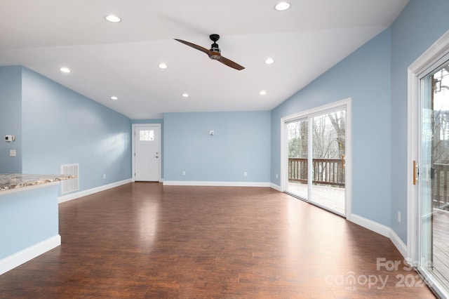 unfurnished living room with ceiling fan, dark wood-type flooring, and vaulted ceiling