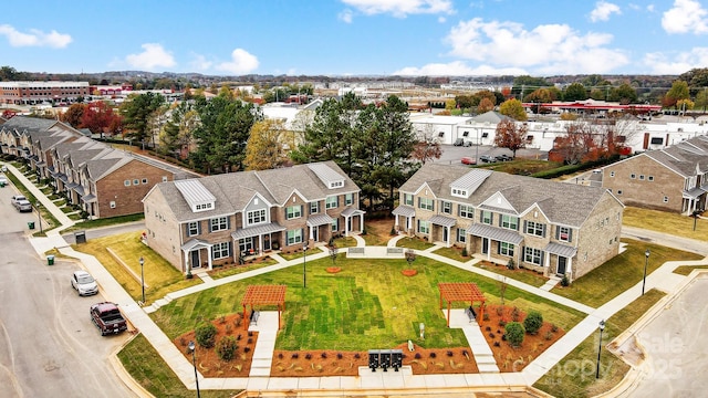 birds eye view of property with a residential view