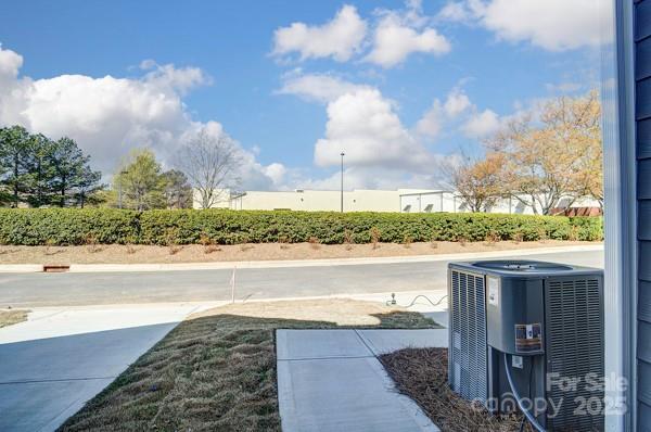 view of yard with central air condition unit