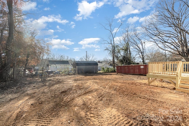 view of yard featuring a wooden deck