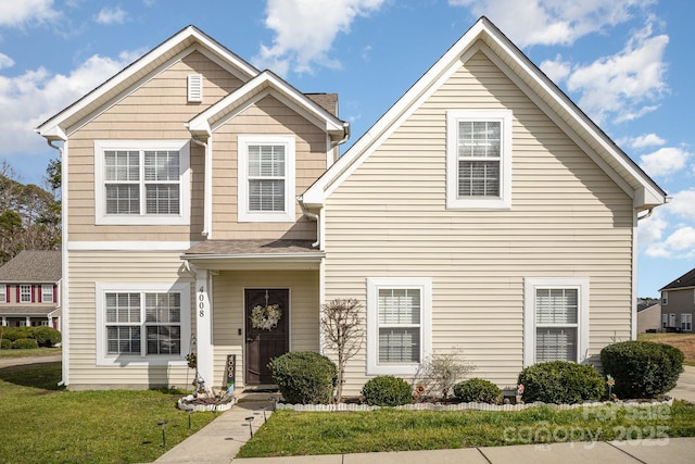 traditional-style home with a front yard