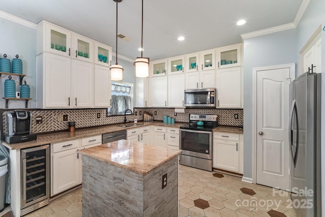 kitchen with a center island, stainless steel appliances, white cabinets, wine cooler, and glass insert cabinets