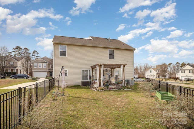 rear view of property featuring a pergola, a yard, a residential view, and a fenced backyard