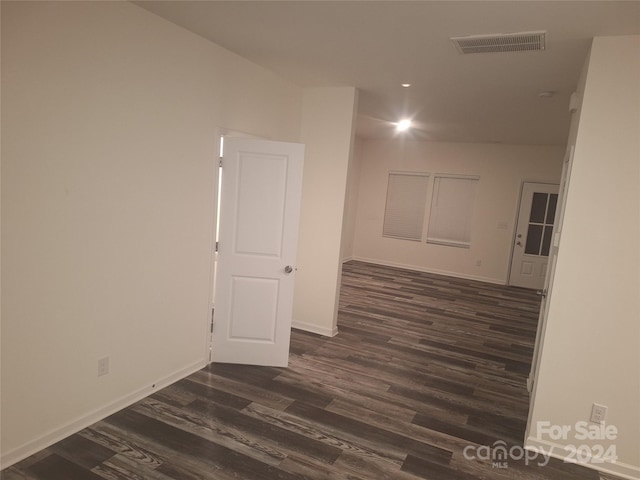 spare room with dark hardwood / wood-style flooring