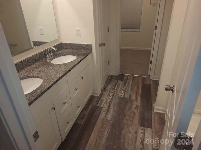 bathroom featuring vanity and hardwood / wood-style flooring