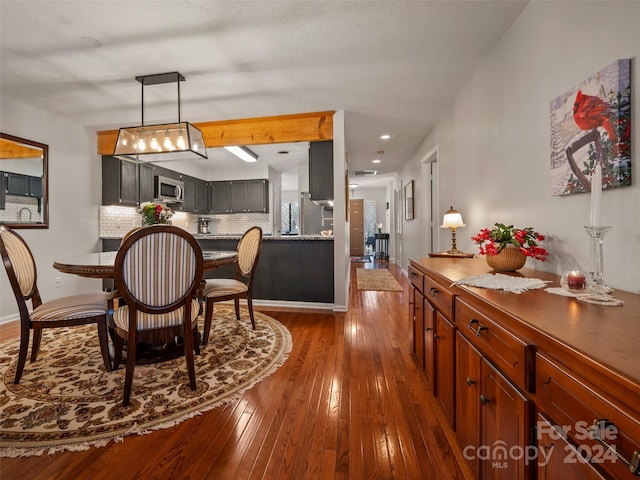 dining area with dark wood-type flooring