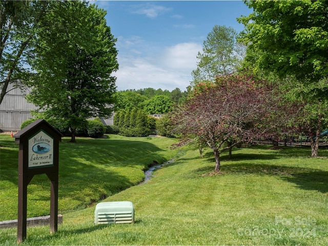 view of property's community with a yard