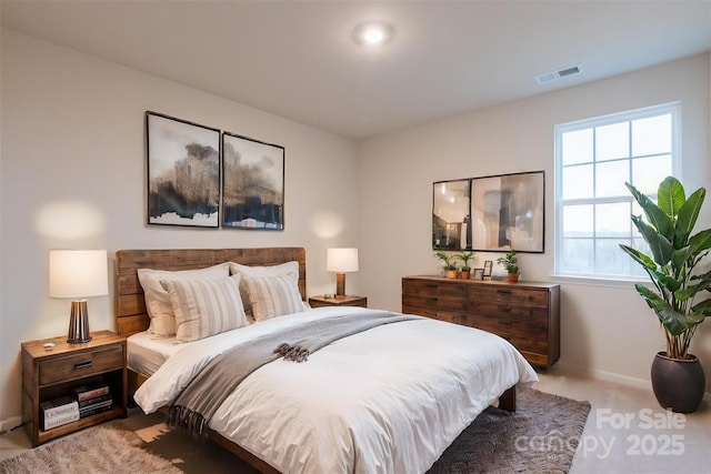 bedroom featuring light colored carpet