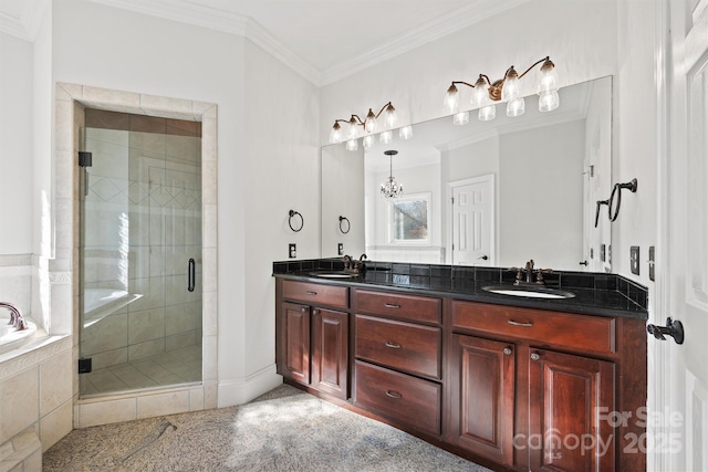 bathroom with vanity, a chandelier, ornamental molding, and independent shower and bath