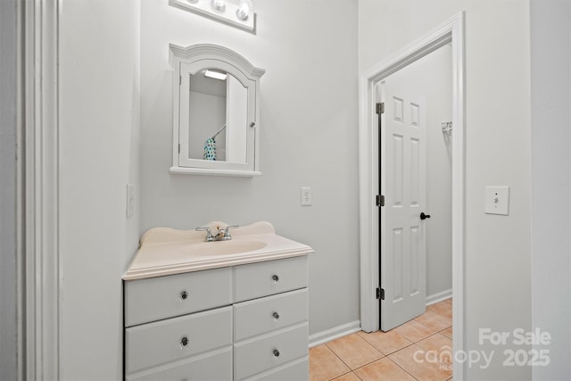 bathroom featuring tile patterned flooring and vanity