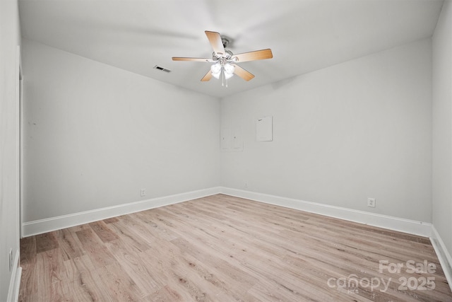 spare room featuring light wood-type flooring