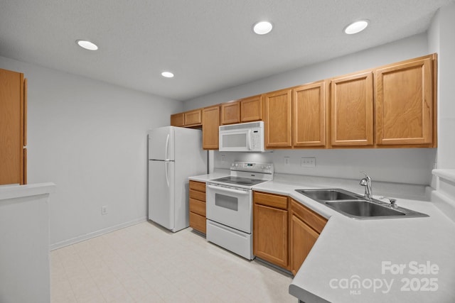 kitchen with sink and white appliances