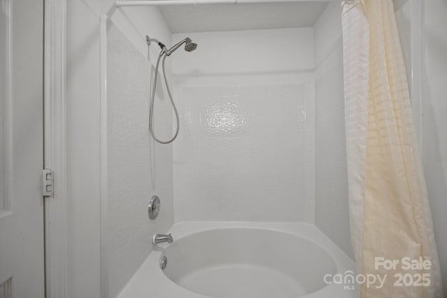 bathroom featuring shower / tub combo with curtain