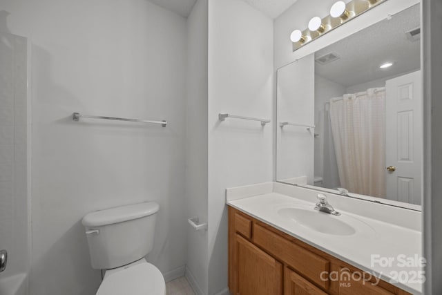 bathroom featuring vanity, toilet, and a shower with shower curtain